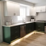 Bright modern kitchen featuring a two-tone cabinet design, large kitchen island, and improved lighting installed as part of the Schaumburg renovation.